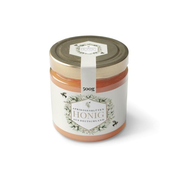 Etikett für Honiggläser mit Aprikosenblüte und Biene