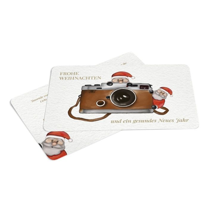 Süße Weihnachtskarte für Fotografen mit Fotoapparat und Weihnachtsmännern