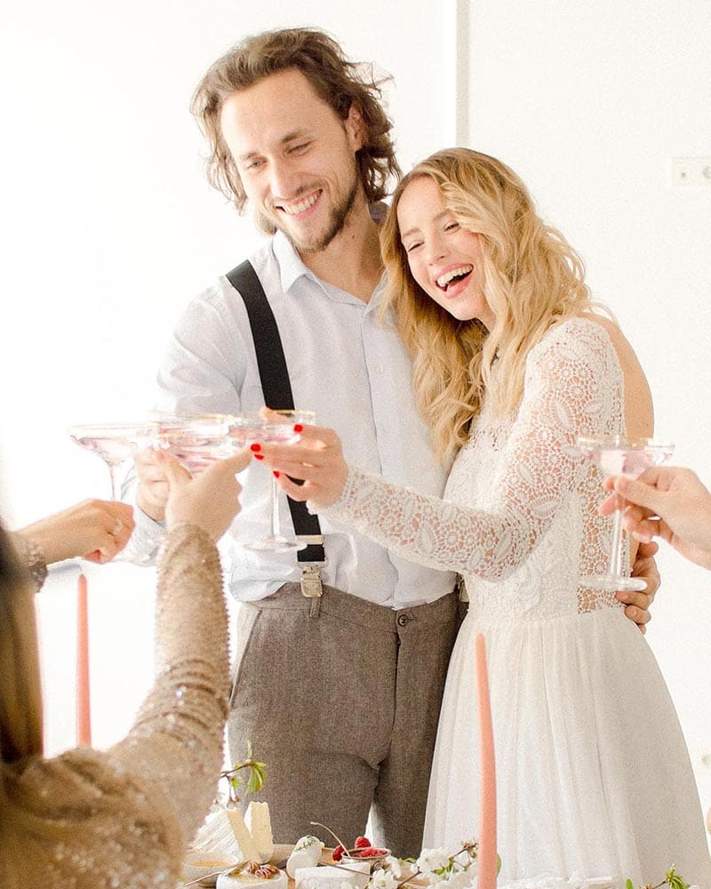 bride-with-groom-drinking-champaigne-on-their-wedding-freepik